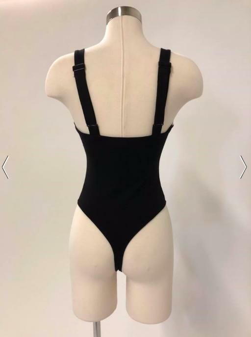 STYLE INFORMATION: The Date Night Black Bodysuit has that seductive look you've been looking for! Black knit fabric shapes a square, notch collar neckline, coupled with wide, adjustable straps. Fitted bodice hugs your figure down to a cheeky bottom with snap closures. DETAILS & CARE: Rayon/Cotton/Elastane. Hand wash cold. Imported. SHIPPING: Orders are processed within 1-2 business days. Packages are shipped out Monday-Friday, holidays are excluded. Collar Bodysuit, Boho Pink, Tank Bodysuit, Sleeveless Bodysuit, Notch Collar, Shipping Orders, Hug You, Notched Collar, Black Bodysuit