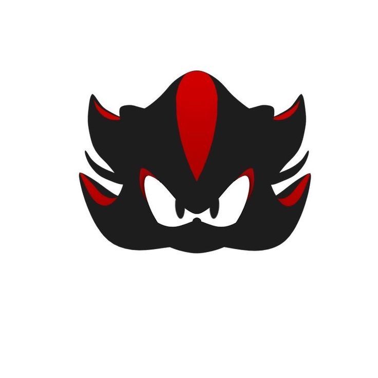 a black and red demon mask with large fangs on it's face, in the middle