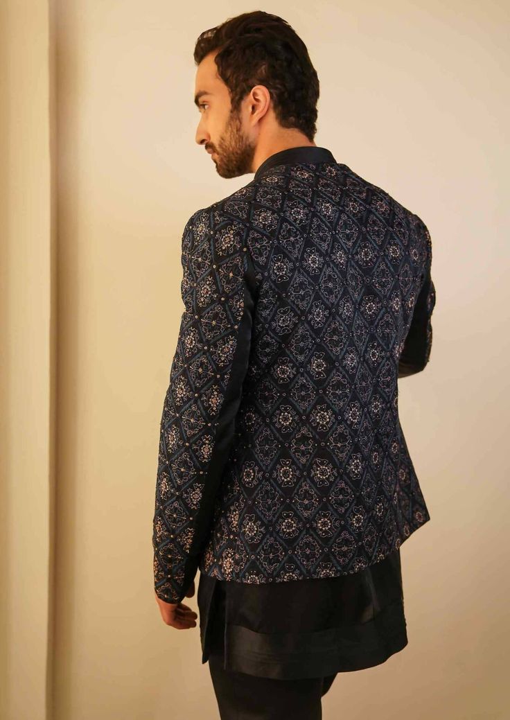 Featuring our bestseller short jacket, now in a midnight blue color. After being a hero outfit for consecutive two seasons, we are now showcasing the jamawar embroidered short jacket with dabka highlighting, in our new color. Paired with short embroidered hem kurta with tapered trousers. Festive Blue Nehru Jacket With Intricate Embroidery, Blue Bollywood Nehru Jacket With Intricate Embroidery, Festive Embroidered Blue Nehru Jacket, Transitional Embroidered Blue Nehru Jacket, Ceremonial Blue Embroidered Nehru Jacket, Hero Outfit, Embroidered Hem, Midnight Blue Color, Tapered Trousers