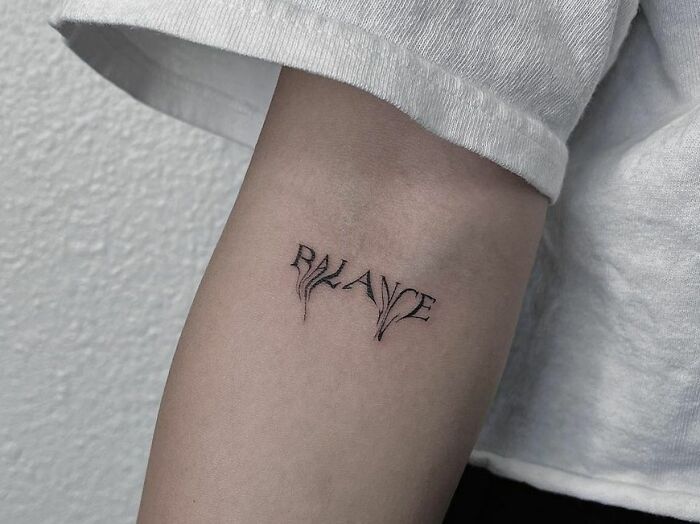 a woman's arm with a tattoo that reads, rlaup on it