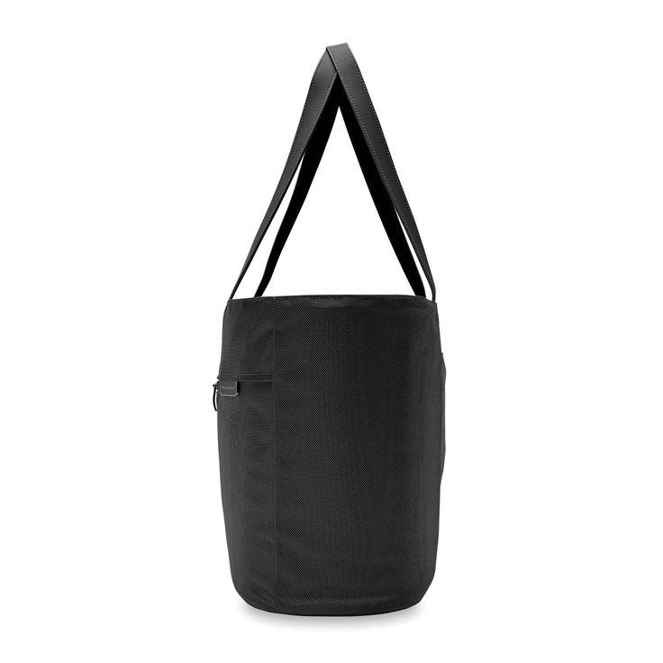 This Traveler Tote is a must-have for a life of travel. Make this your go-to bag on trips near and far. Its spacious capacity allows you to fit it all. Practical Large Capacity Travel Accessories For On-the-go, Functional Duffle Bag With Removable Pouch Tote, Functional On-the-go Tote Bag, Large Capacity Nylon Satchel For On-the-go, Modern On-the-go Tote Luggage, Large Capacity Nylon Laptop Bag For On-the-go, Functional Tote Duffle Bag For Daily Use, Versatile Shoulder Bag For On-the-go Travel, Functional Tote Travel Bag For Daily Use