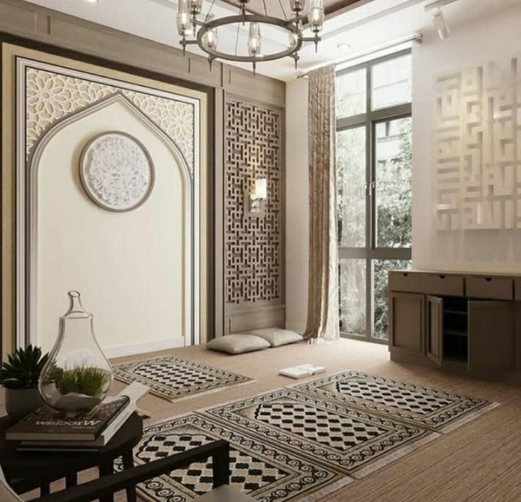 a living room filled with furniture and a chandelier hanging over the top of it