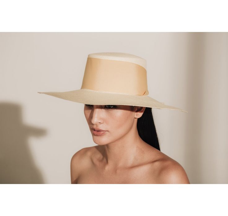 Long Brim Cordovan Hat With Maxi Bow The Panama Hat, also known as Montecristi Hat is a traditional Ecuadorian model made with 100% Toquilla Straw, a natural fiber known for its quality and beauty. The perfect beach-to-city accessory, elegant, yet fresh and versatile for original matches with different kinds of fashion. -We ship with DHL Express. Shipping takes approximately 3 to 5 days to arrive depending on the destination. -Need Help? Please contact: customercare@sensistudio.com -All Sales Ar High Crown Straw Hat For Summer Vacation, Summer Vacation High Crown Straw Hat, Summer Beach Boater Hat With High Crown, Toquilla Straw High Crown Hat For Summer, Summer High Crown Boater Hat For Beach, Summer Sinamay Hat With Flat Brim, Summer Flat Brim Sinamay Hat, High Crown Toquilla Straw Hat For Summer, Cream Fitted Sun Hat With Flat Brim