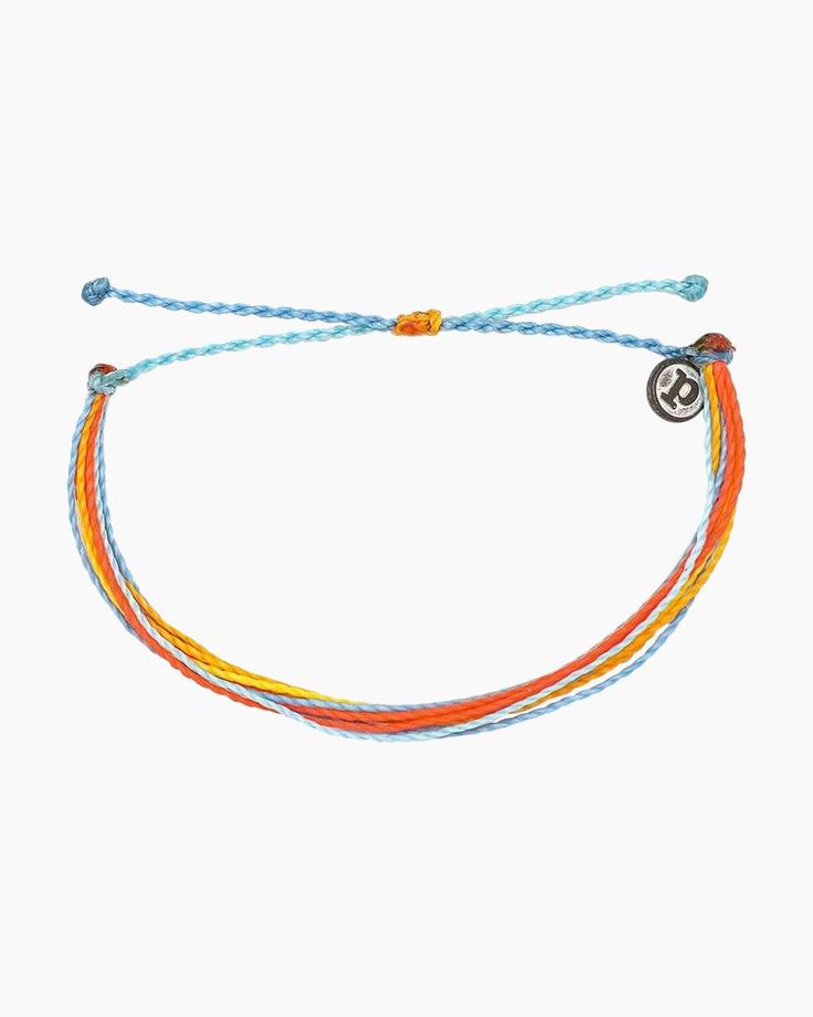 The Citrus Surfline bracelet from Pura Vida is decked out yellow, orange, and blue, and it can be adjusted for the perfect fit every time. Made from 100% waterproof cord and so much fun to wear and layer, it can follow you anywhere spring and summer take you - with a little boho flair thrown in to help you catch the waves!Adjustable from 2-5 Inches in DiameterWax-coated cord is 100% waterproofPura Vida logo charm Pure Vida Bracelets Pura Vida, Pita Vida Bracelets, Adjustable Blue Friendship Bracelets For Vacation, Multicolor Braided Bracelets With Sliding Knot For Everyday, Multicolor Braided Bracelet With Sliding Knot For Everyday, Everyday Multicolor Friendship Bracelet With Waxed Cord, Multicolor Adjustable Jewelry For Beach, Multicolor Nylon Cord Bracelets For Summer, Blue Adjustable Cord Friendship Bracelets For Summer