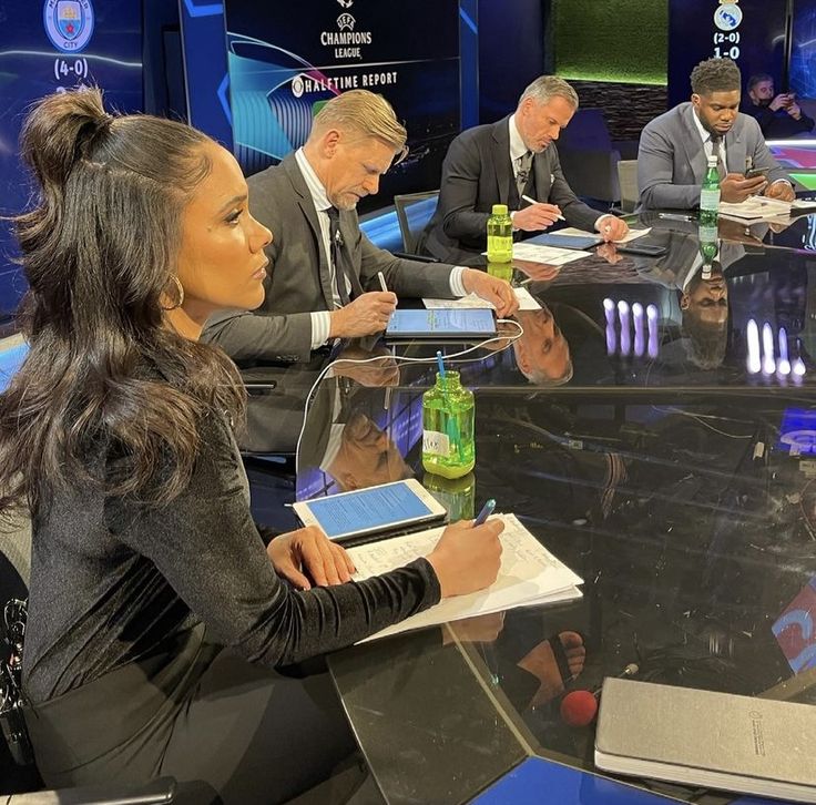 a group of people sitting around a glass table