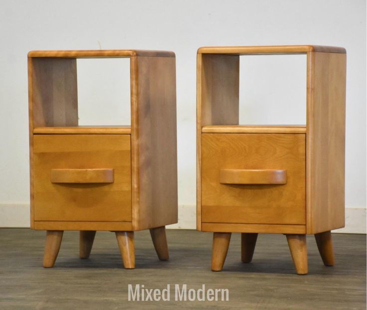 two wooden nightstands sitting side by side on the floor