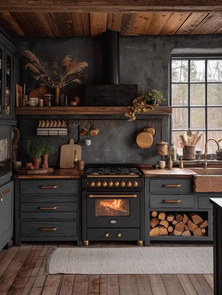 a kitchen with an oven, stove and counter tops in black painted wood planks