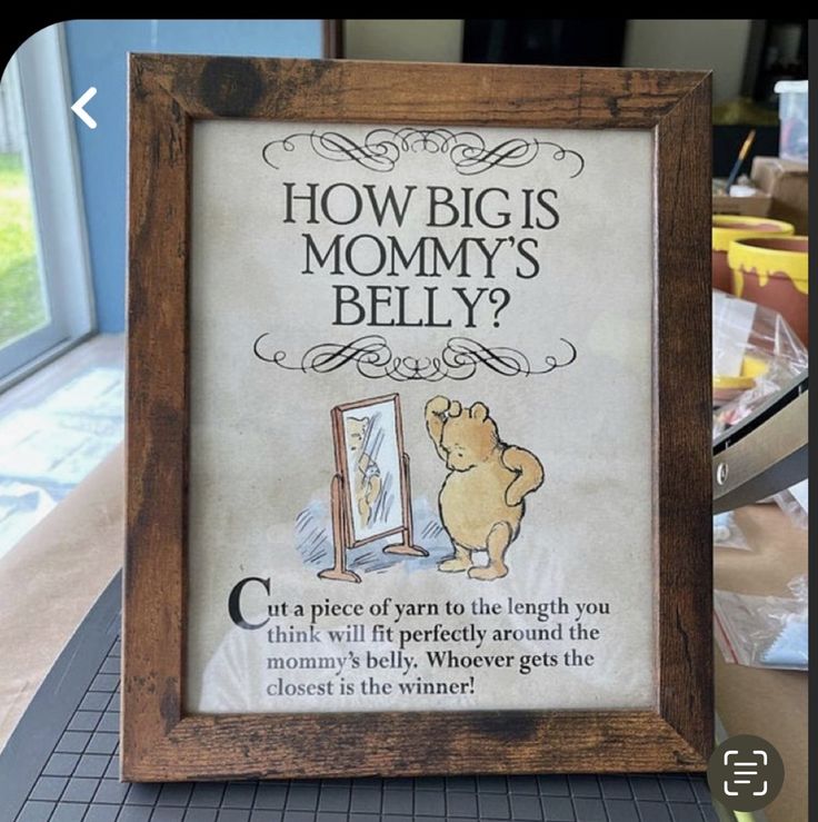 there is a sign on the table that says how big is mommy's belly?