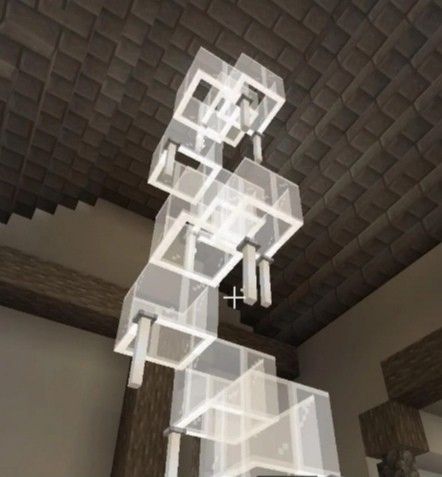 an artistic rendering of a building made out of cubes and blocks with lights on the ceiling