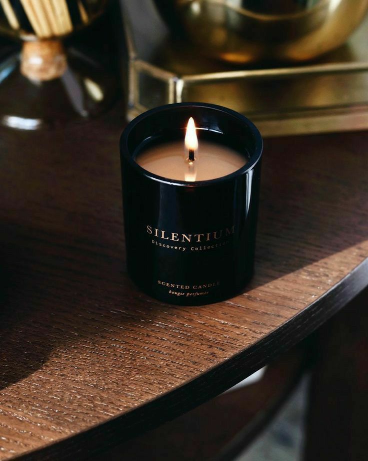 a candle sitting on top of a wooden table