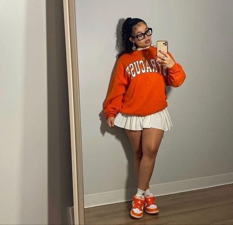 Outfit With Orange Dunks, Orange Outfit Black Women, Pink Collared Shirt Outfit, Preppy Outfits Black Women, Fall Graduation Outfit, Fall Outfits Girly, Pleated Skirt Outfit Black Women, Sweatshirt And Skirt Outfit, Nerd Outfit