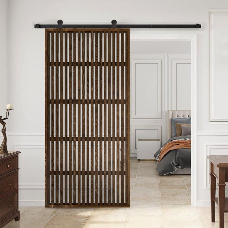 an open wooden door in a white room