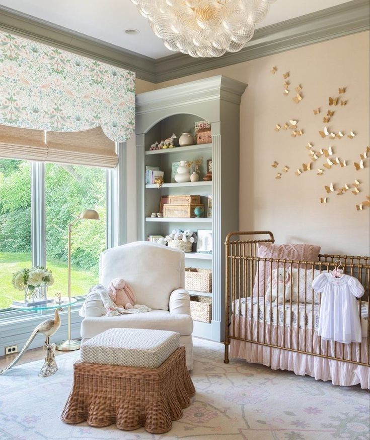 a baby's room is decorated in pink and gold