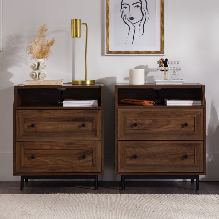 two wooden dressers sitting next to each other on top of a carpeted floor