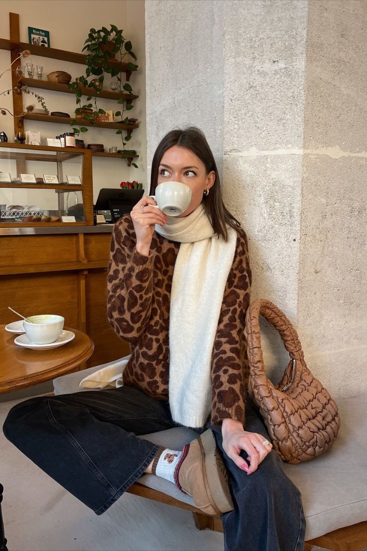 @anneorion is wearing the Sézane Noah Cardigan in leopard print, perfectly paired with black jeans and a white scarf for a cozy fall look. Check out our latest arrivals at sezane.com or via the app.​ Leopard Cardigan Outfit, Leopard Print Outfits, Outfit Cardigan, Leopard Cardigan, White Scarf, Fall Fits, Outfit Inspo Fall, Style Chic, Cozy Fall