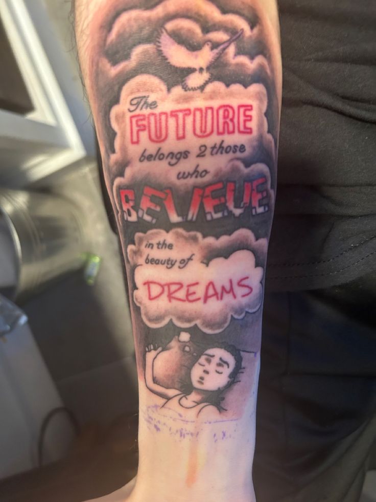 a person with a tattoo on their arm that says the future belongs and those believe in the wings of dreams