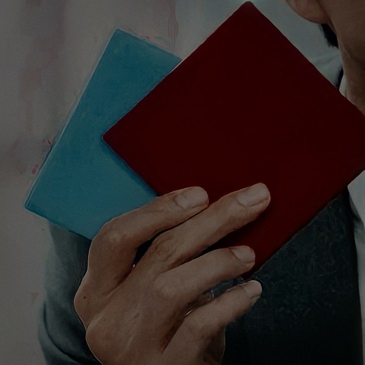 a woman holding a red and blue piece of paper