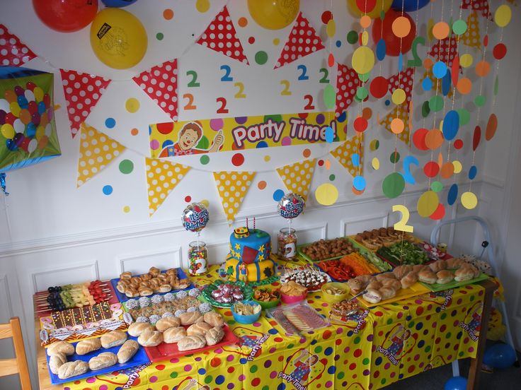 a party time table with lots of food and decorations