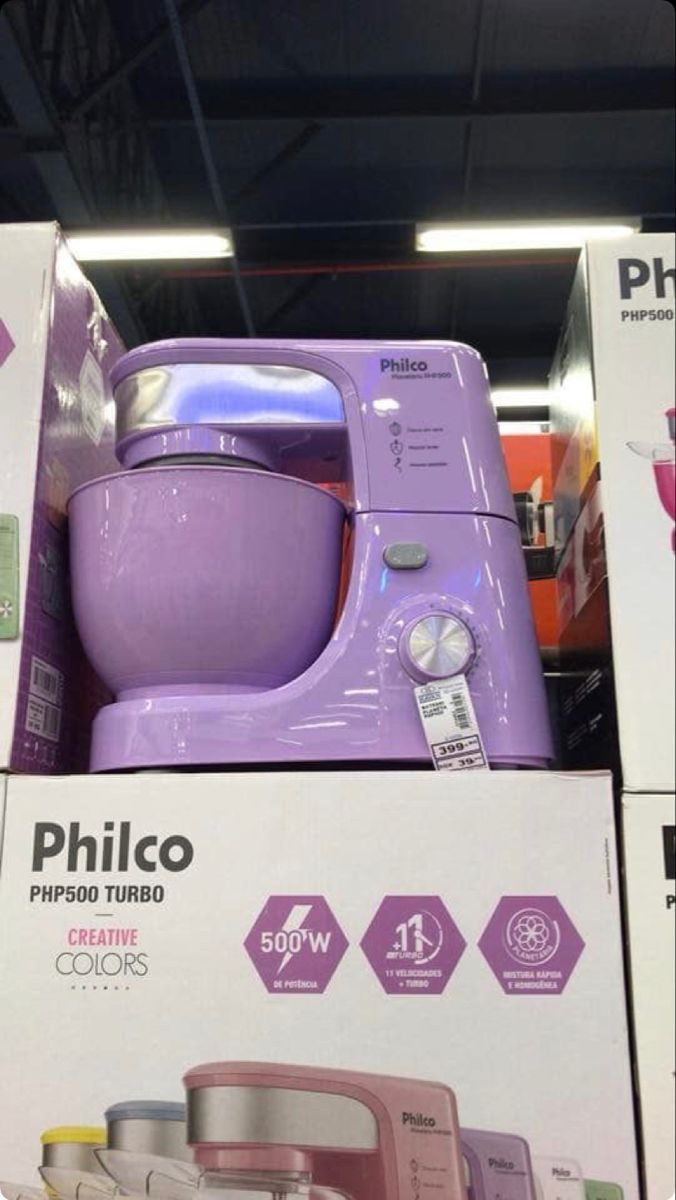 purple appliances are on display for sale in a store