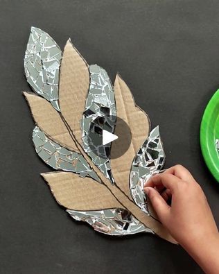 someone is making a leaf out of paper