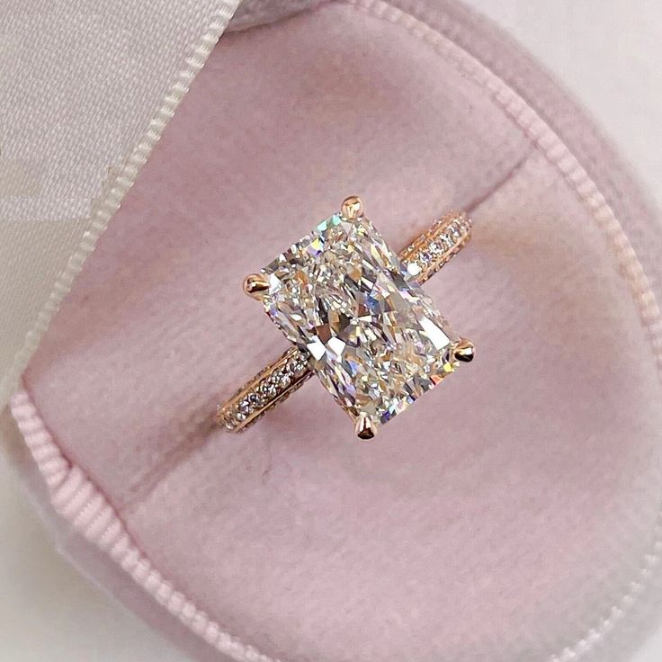 an engagement ring with a cushion cut diamond