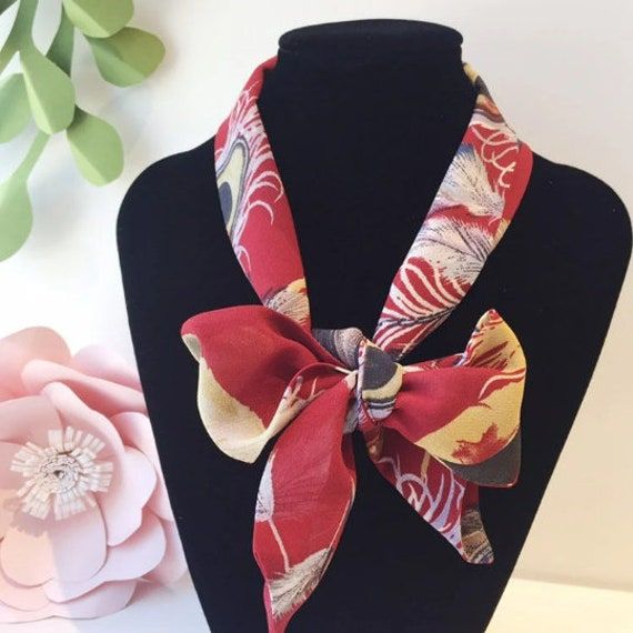 "Handmade chiffon scarf is the perfect length to tie a bow around your neck. Very lightweight and breathable fabric. Tapered ends make it easy to style. Can also be used as a hair accessory, handbag accessory and neck tie.   Length: 37.5\" Width: 2.25\" Hand wash and lie flat to dry. Made from a chiffon silk blend." Dark Red Scarf, Boho Hair Scarf, Handbag Scarf, Neck Scarf Tying, Silk Chiffon Scarves, Boho Hair, Gold Vermeil Jewelry, Red Scarf, Hair Scarf