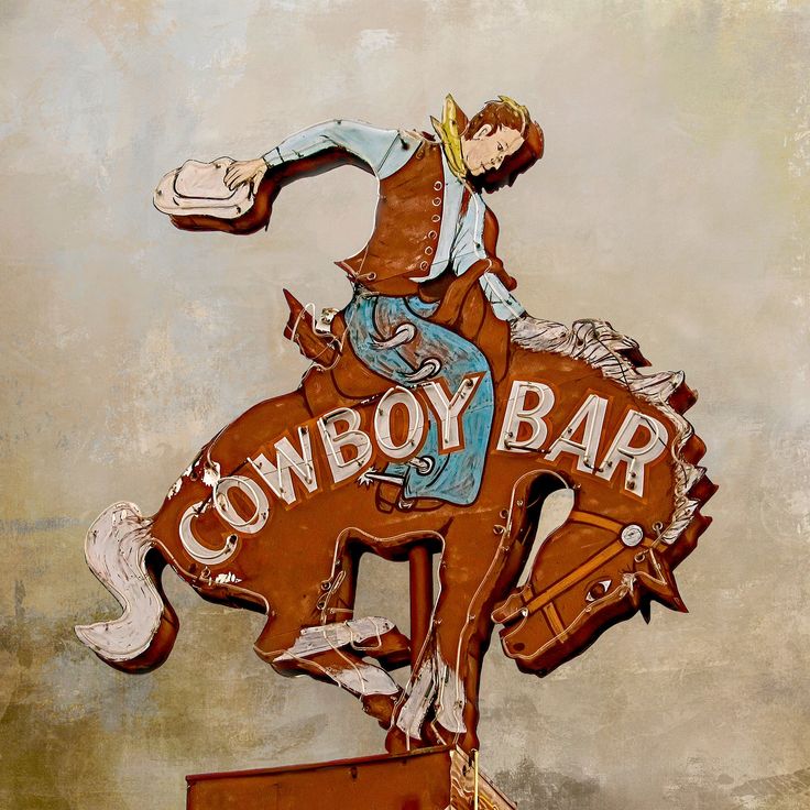 a painting of a cowboy riding on the back of a horse with words cowboys written on it