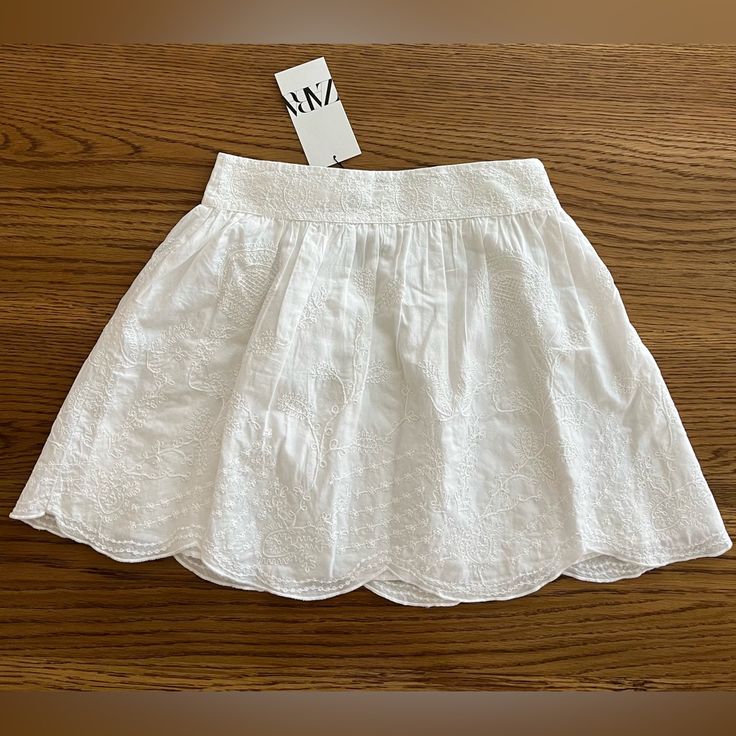 New With Tag. Size: Xs Color: White Ref 5107/242 Mini Skirt With A High Waist. Self Embroidered Detail. Scalloped Hem. Interior Lining. Hidden In Seam Zip Closure. Material: Embroidery: 100% Polyester Main Material: 100% Cotton Lining: 100% Cotton High Waist Skirt, Zara Skirts, Zara White, Scalloped Hem, Waist Skirt, High Waisted Skirt, Mini Skirt, Womens Skirt, High Waist