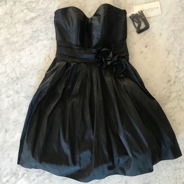 This Strapless Dress Has Never Been Worn Or Altered. Fitted Bodice With The Sweetheart Neckline, A Full Skirt And Pockets! Comes With Straps That Can Easily Be Snapped Into Place (See Photo). Black A-line Strapless Dress For Spring, Elegant Black Mini Dress With Pleated Bodice, Black Cocktail Dress With Pleated Bodice, Chic Black Strapless Dress With Pleated Bodice, Black Sweetheart Neckline Dinner Dress, Black Sweetheart Neckline Dress For Dinner, Black Strapless Dress With Pleated Bodice For Cocktail, Spring Black Strapless Dress With Sweetheart Neckline, Black Strapless Dress With Sweetheart Neckline For Spring