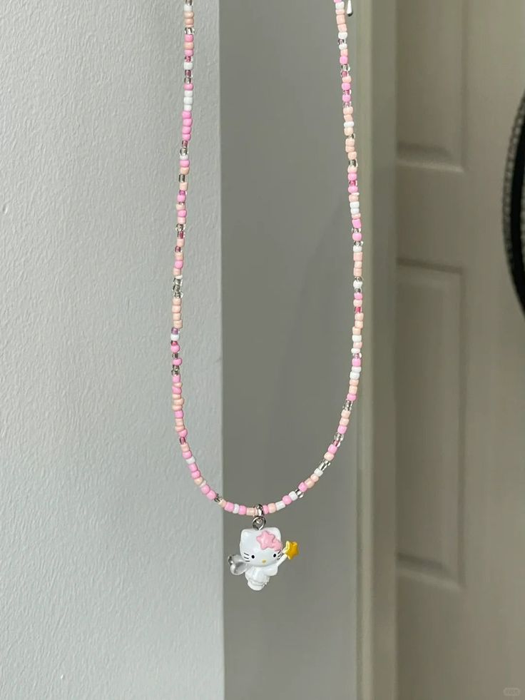 Pink Kitty Necklace Hand Beaded This adorable hand-beaded Pink Kitty Necklace is perfect for any fashion-forward feline lover. With its playful pink design and delicate construction, it's sure to add a touch of cuteness to any outfit. Show off your love for kitties with this charming accessory. Size: 38m-45cm Trendy Pink Beaded Necklaces With Heart Beads, Cute Pink Beaded Chain Jewelry, Cute Handmade Pink Beaded Necklaces, Cute Pink Beaded Jewelry, Trendy Pink Beaded Chain Necklaces, Cute Pink Beaded Chain Necklaces, Cute Pink Necklaces With Tiny Beads, Cute Pink Beaded Necklaces, Cute Pink Beaded Chain Necklace