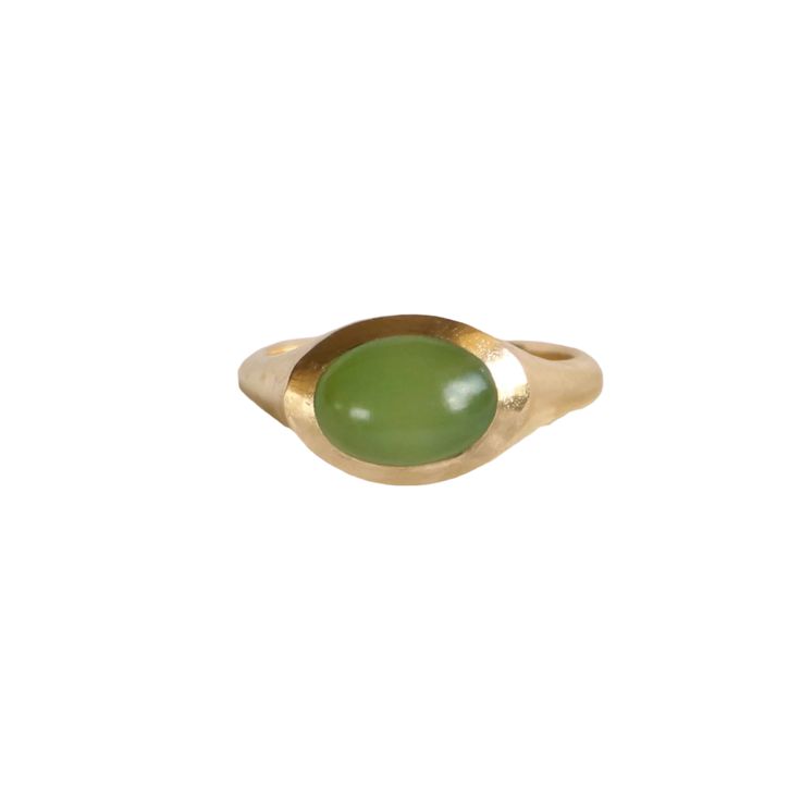 EYE-CATCHING WHAT IT IS: Gold Inanga Pounamu Small Oval Cabochon Ring WHY IT’S SPECIAL: Courtney's distinctive, minimalist designs, allow the gemstones of New Zealand to shine The rounded cabochon holds the light and color of the grey-green stone to allow a beautiful glow GOOD TO KNOW: Pounamu (Jade) 9k gold WHY WE LOVE COURTNEY MARAMA: Inspired by her rich heritage and her environmental values, Courtney thoughtfully hand makes everything in her Waikato studio with this ethos in mind. She uses 5 Oval Cabochon Opal Ring With Polished Finish, Modern Jade Gemstone Jewelry, Modern Green Oval Cabochon Jewelry, Modern Oval Green Jewelry, Timeless Green Oval Signet Ring, Modern Cabochon Emerald Ring, Modern Yellow Gold Jade Jewelry, Timeless Signet Ring With Oval Cabochon Gemstone, Oval Yellow Gold Rings With Natural Stones