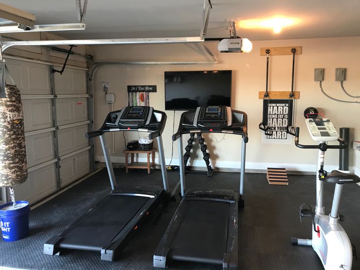 a garage with treadmills and exercise equipment