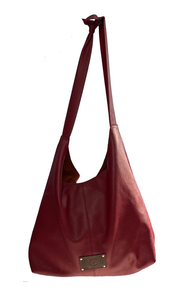 100% upcycled leather tote with adjustable straps, inside pocket and magnetic closure. handcrafted by women artisans. available in red, black, & brown Versatile Red Tote Satchel, Versatile Red Satchel In Tote Shape, Burgundy Leather Tote Hobo Bag, Burgundy Leather Handle Hobo Tote Bag, Burgundy Hobo Bag With Leather Handles, Burgundy Leather Hobo Bag Tote, Versatile Red Satchel For Everyday Use, Versatile Everyday Red Satchel, Burgundy Tote Shoulder Bag For Errands