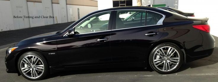 a black car parked in front of a building