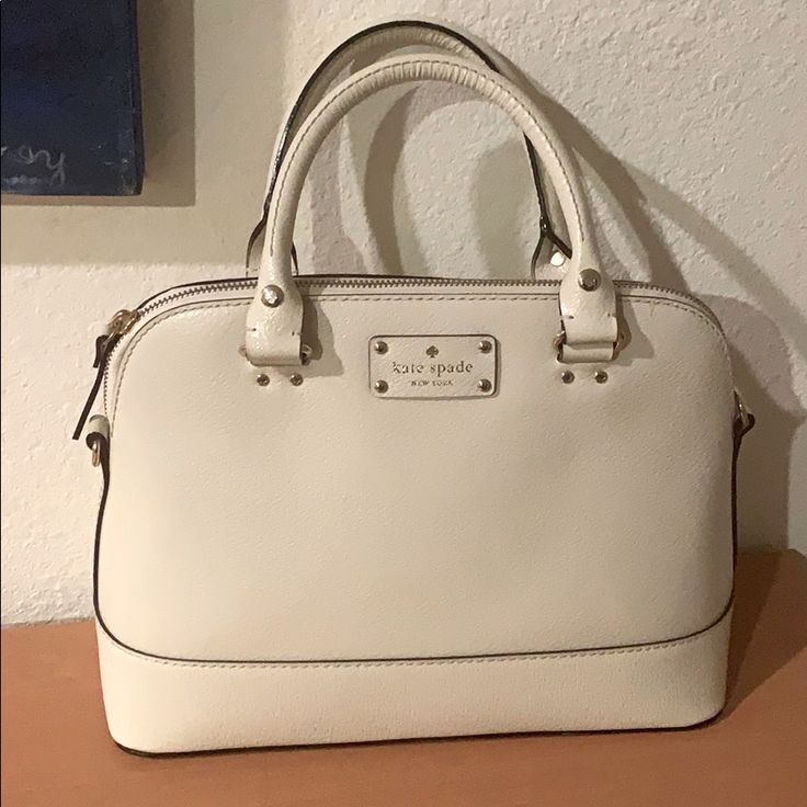 9 Inch Height, 13 Inch Width Across One Side, 4,5 Inch Depth . Nwot, Comes With Crossbody Strap. Ivory White 100% Cow Leather Exterior. Pink Polka Dot Interior. With Dust Bag. Pink Polka Dots, Ivory White, Kate Spade Bag, Crossbody Strap, Cow Leather, Wallets, Polka Dot, Kate Spade, Dust Bag