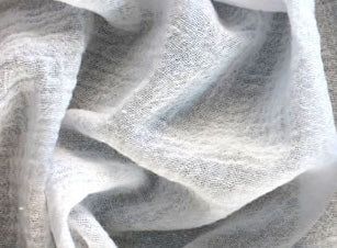 an image of a white cloth textured with light grey yarns or fabric material