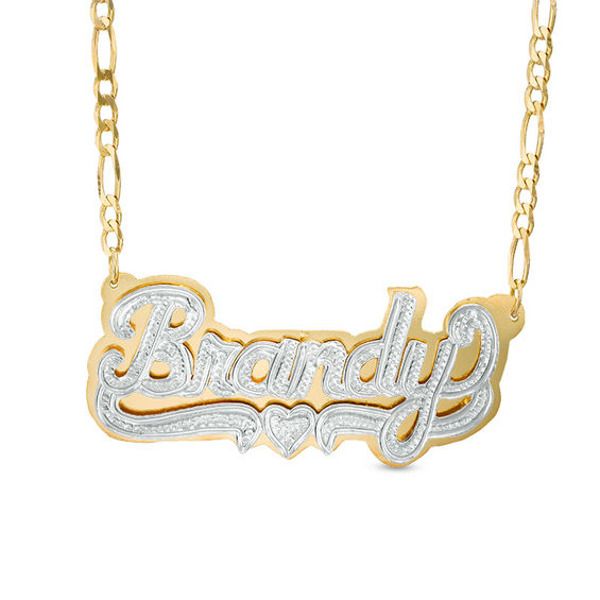 Gift yourself or someone special with this unique name necklace. Fashioned in sleek sterling silver and 24K gold plating, this three-dimensional design spells out her name, 3 to 10 characters in length, in a stylish hammered font. Beneath the name, a similarly textured heart and ribbon accent completes the look. The design is centered along an 18.0-inch figaro chain that secures with a lobster claw clasp. Custom Gold Necklace With Name On Heart Pendant, Engraved Custom Nameplate Necklace For Anniversary, Custom White Nameplate Necklace, Gold Nameplate Jewelry With Names, Anniversary White Gold Nameplate Necklace, Gold Double Heart Name Necklace, Gold Custom Nameplate Necklace For Valentine's Day, Engraved Nameplate Necklace For Anniversary, Anniversary Engraved Nameplate Necklace