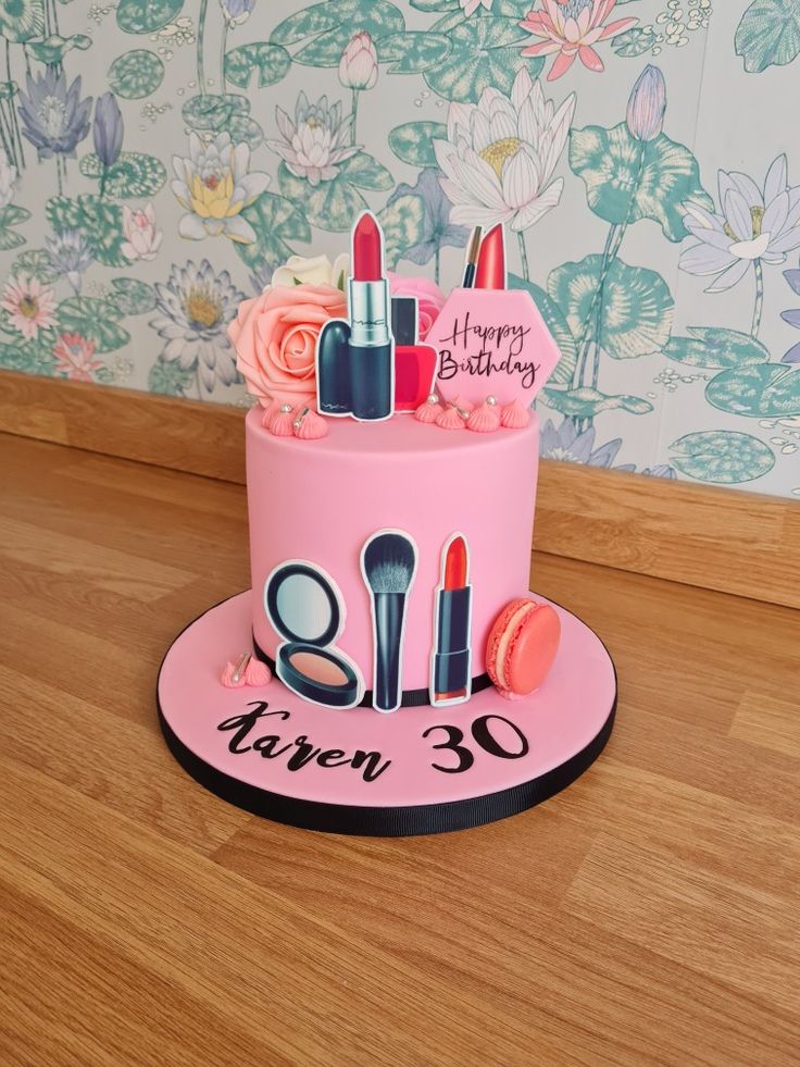 a pink birthday cake with makeup and lipstick on the top that says happy birthday eleven 30