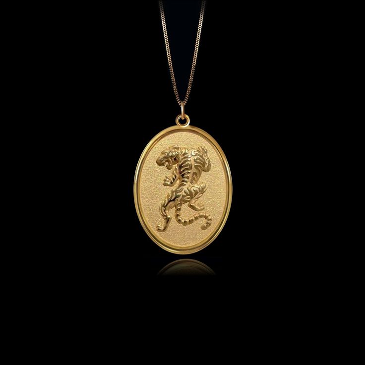 PENDANT INFORMATIONThis pendant is made of real, solid gold.• Made in USA• Material: 14k or 18k solid gold• Finish: polished• Height: 1.24" (31,5 cm) x Width: 0.87" (22 mm)• Pendant weight: approx. 6 grams (14k)• Bail: fits up to 4 mm chains• Solid back, not hollow• A certificate of authenticity is included• Delivered in our elegant jewelry box, making it the perfect gift Shipping: All of our orders are custom-made. Please allow approximately 3 weeks for production and shipping. Shipping include Gold Tiger, Creative Jewelry Photography, Tiger Pendant, Phoenix Pendant, Gold Dragon, Egyptian Jewelry, Solid Gold Chains, White Gold Chains, Small Circle