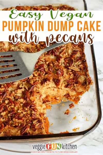 an easy vegan pumpkin dump cake with pecans in a baking pan and a spatula