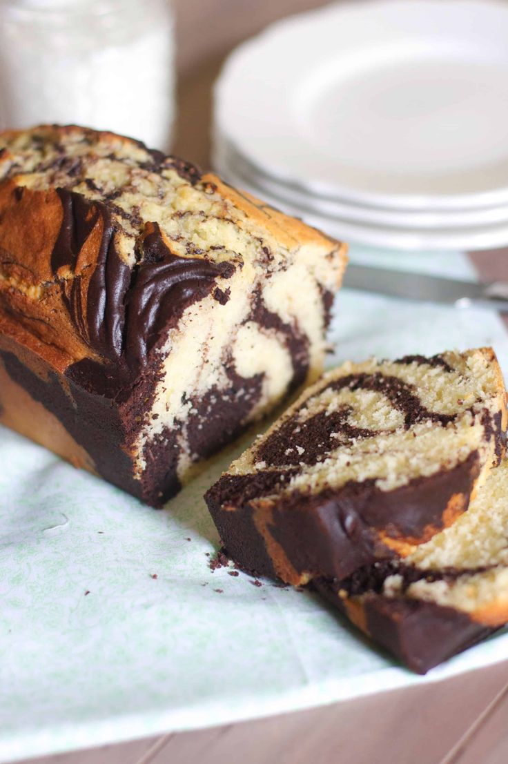 two pieces of cake sitting on top of a table