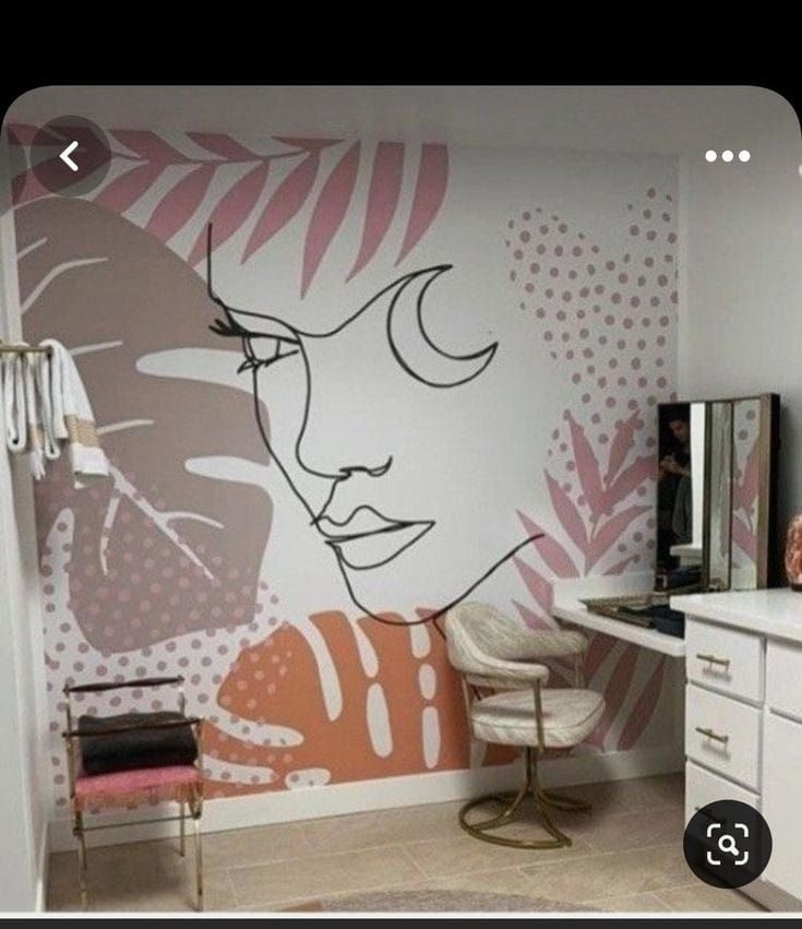 this is a photo of a woman's face painted on the wall