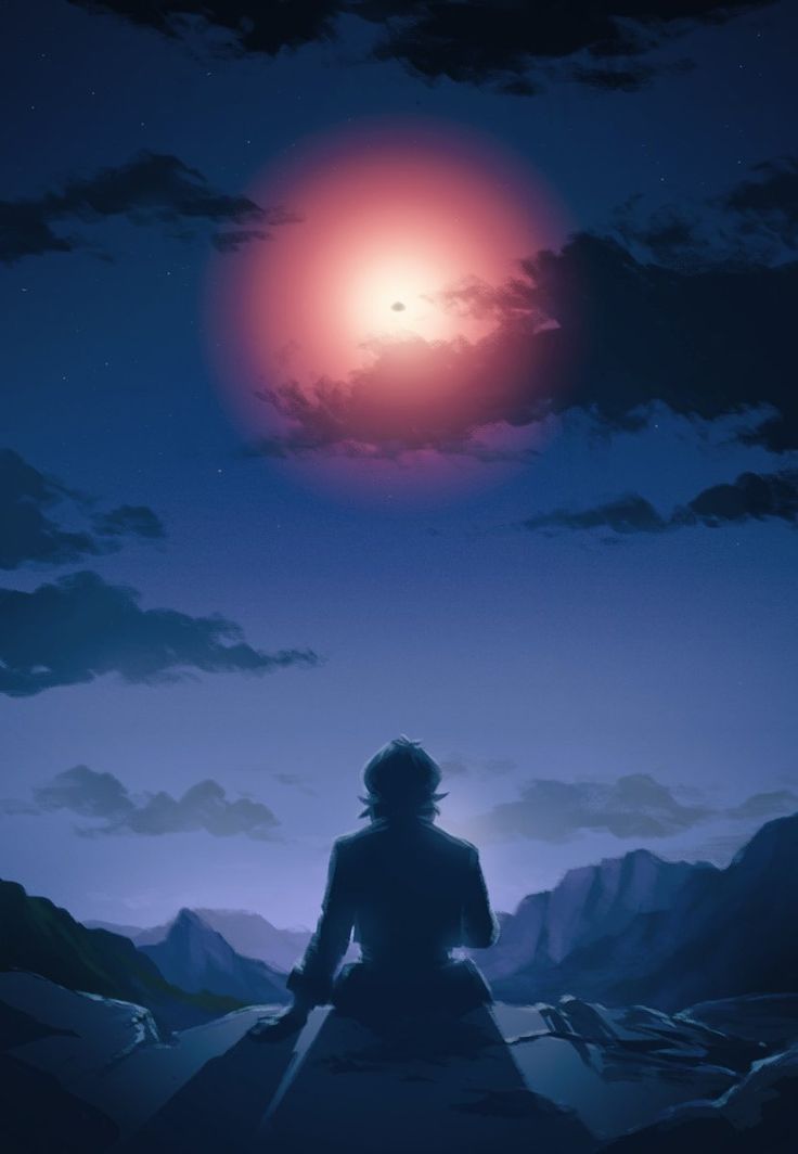 a person sitting on top of a hill under a red moon