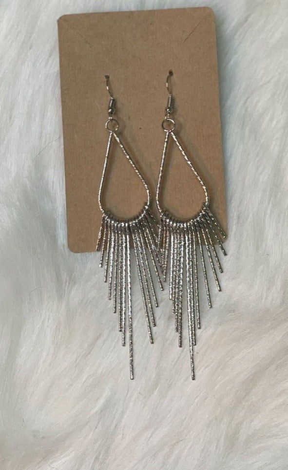 Faux Silver tassel earrings Trendy Silver Dangle Tassel Earrings, Silver Metal Chandelier Earrings With Tassels, Silver Dangle Tassel Earrings, Trendy Silver Tassel Drop Earrings, Trendy Party Tassel Earrings With Dangling Beads, Trendy Tassel Earrings With Dangling Beads For Party, Silver Dangle Earrings With Tassels, Trendy Tassel Earrings With Dangling Beads, Metal Long Drop Tassel Earrings