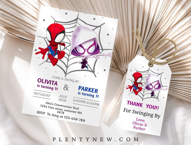 two spider - man birthday party tags on a white plate with fan in the background