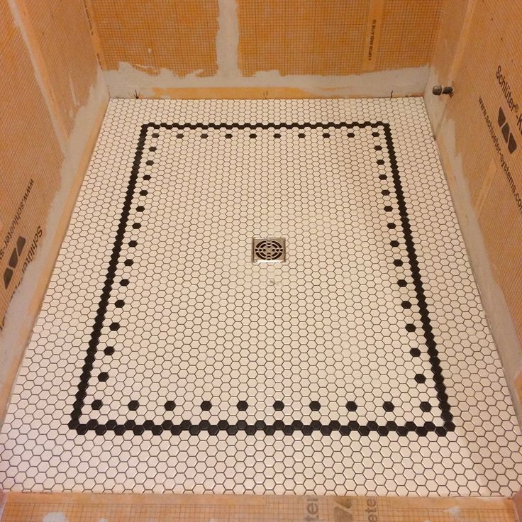 a bathroom that has some kind of tile on the floor in it and is being remodeled