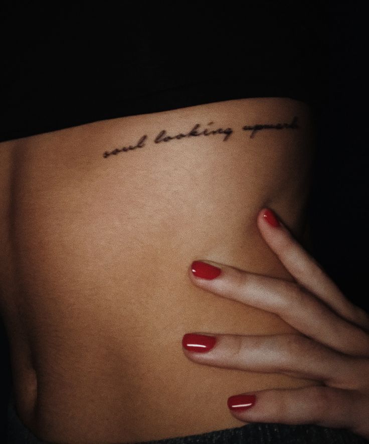 a woman's stomach with the words and making up written on her left side