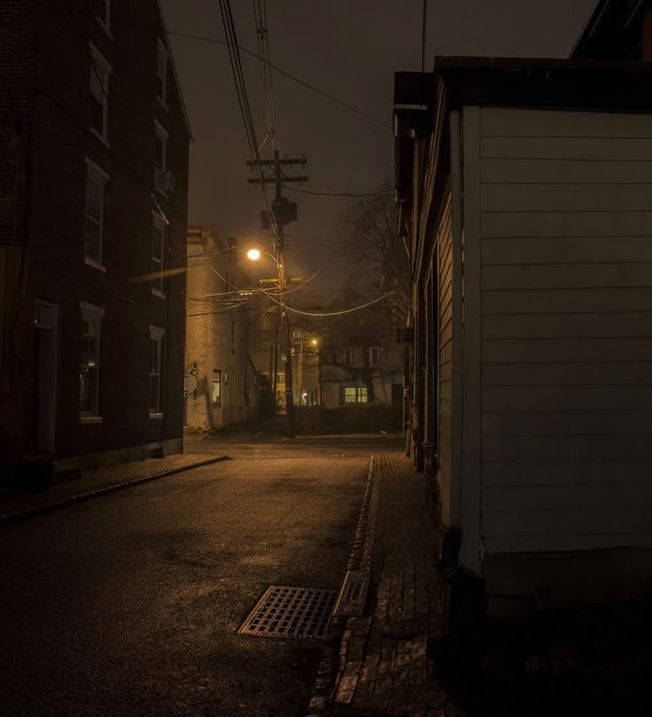 an empty street at night with no one on it