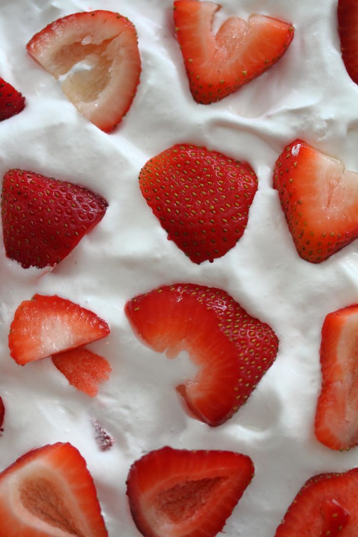 strawberries and whipped cream arranged on top of each other