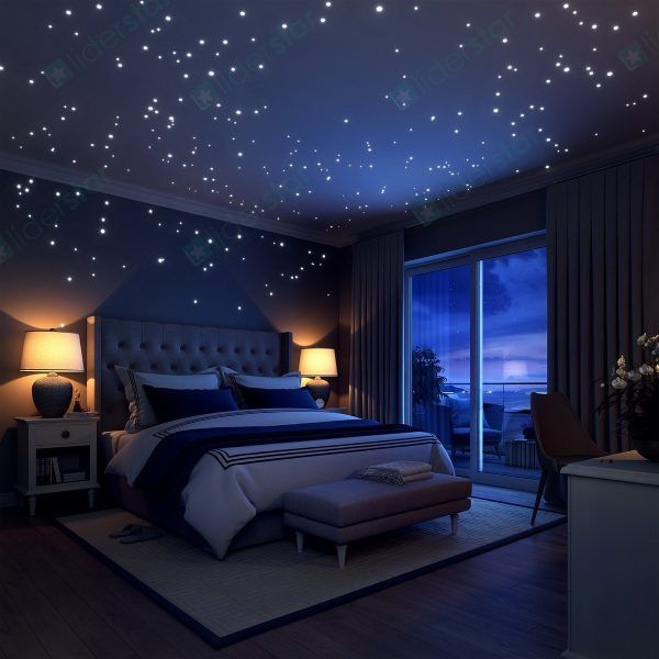 a bed room with a neatly made bed and stars on the wall above it at night